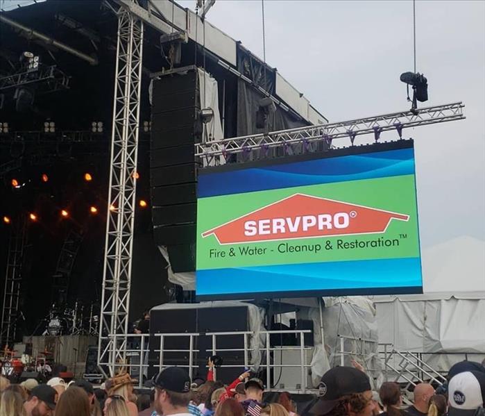The SERVPRO logo on the big screen during the concert