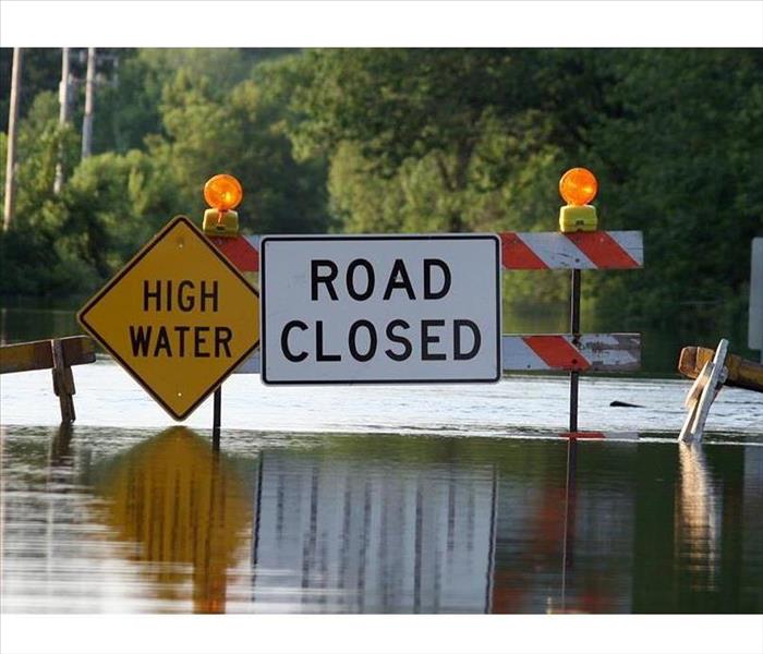 flooded road and sign