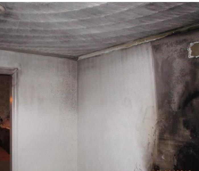 picture of room being cleaned from soot